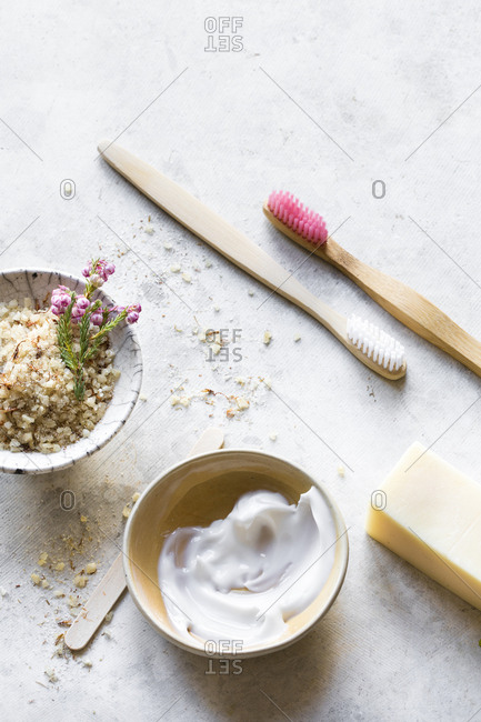 Overhead view of natural skin care products and brushes