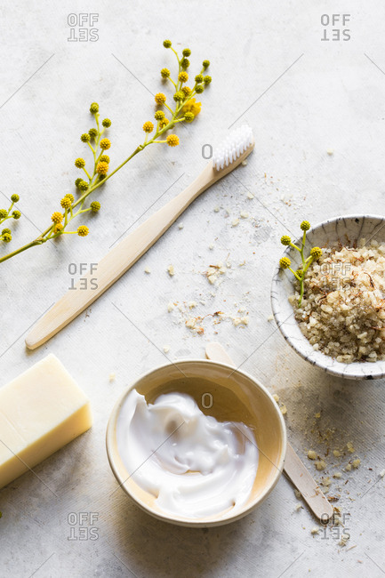 Natural skin care products and yellow flowers