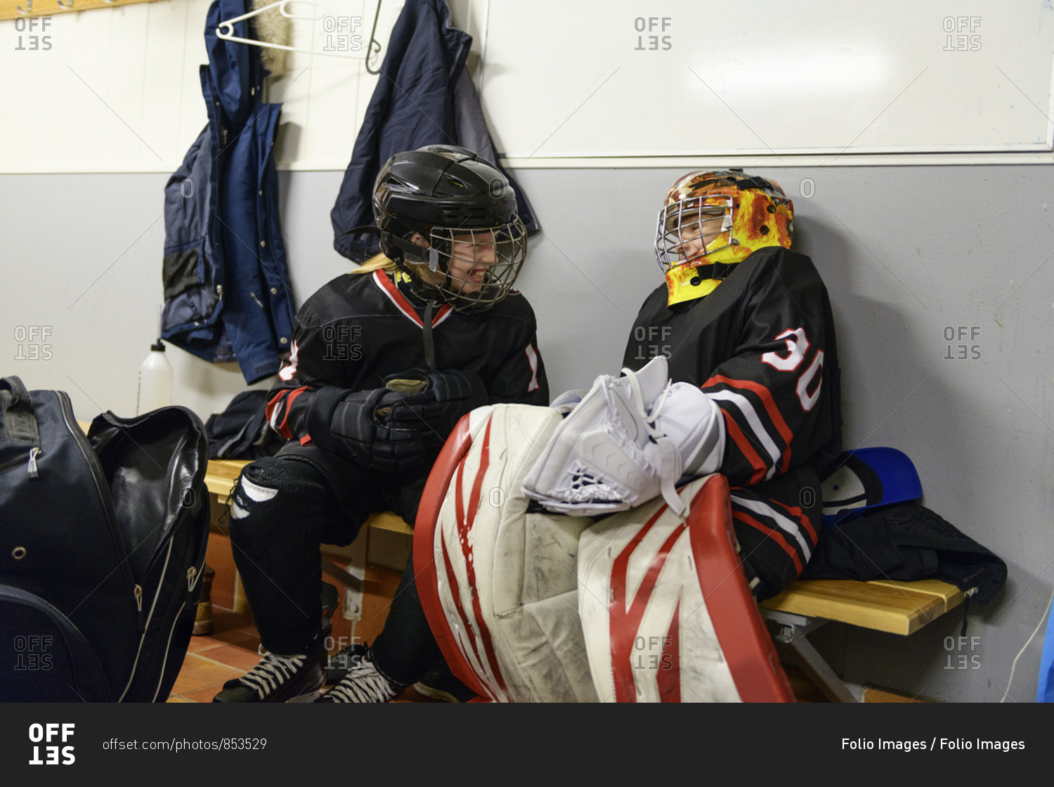 Girls in changing room prepare for ice hockey training