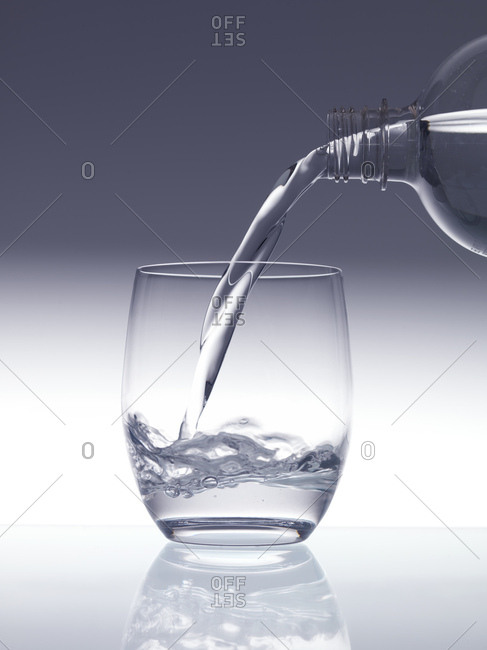 Clean drinking water being poured into a glass.