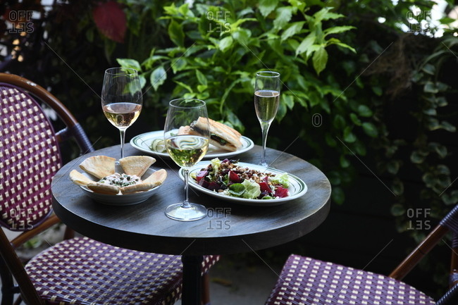 Gourmet dinner served with wine outdoors
