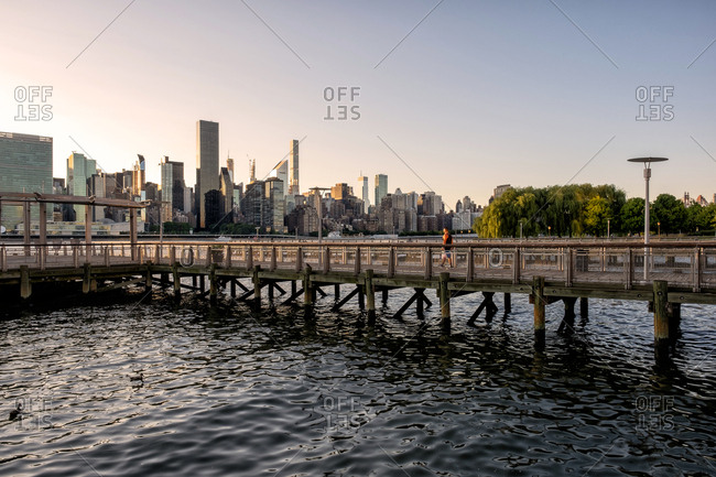 Queens NY - USA - Aug 29 2019: Long Island City Gantry sign and Manhattan midtown skyline in front of east river