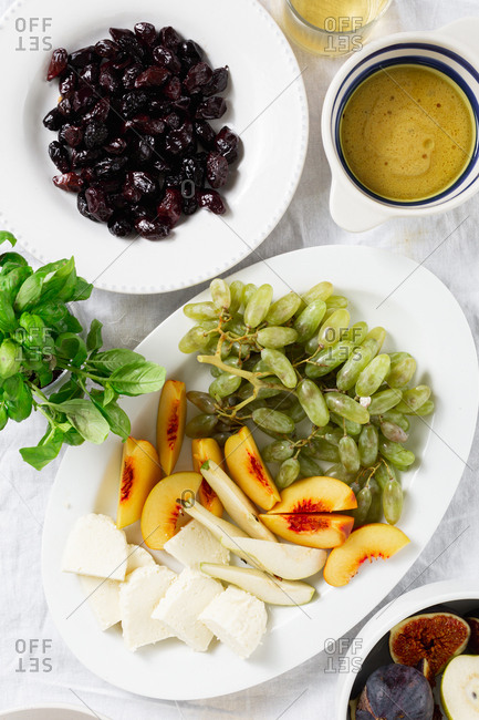 Various fruit wine snacks with cheese and olives