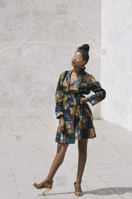Portrait of chic woman wearing patterned dress