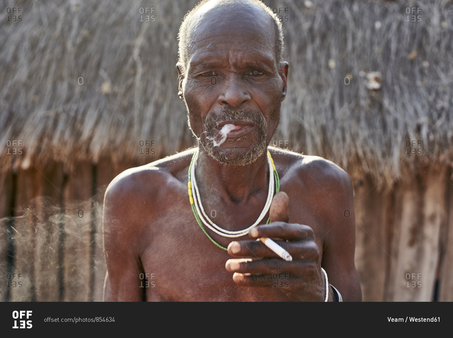 Traditional Mudimba tribe man smoking- Mudimba tribe- Canhimei- Angola ...