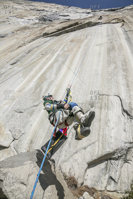 Adaptive climber ascends a rope on zodiac