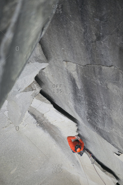 A climber ascends an impressive looking jagged flake high up on El Capitan