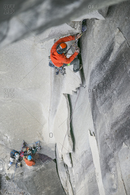 A climber leads an impressive steep and wide pitch high on El Capitan