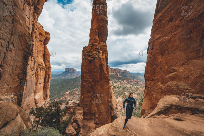 Female trail runner on cathedral rock
