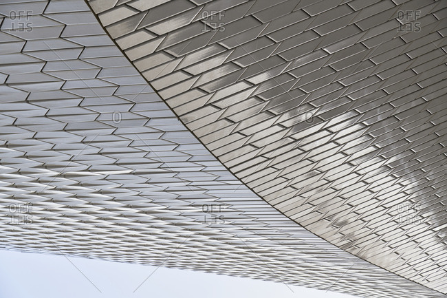 Lisbon, Portugal - September 10, 2019: Curved detail of white geometric tile exterior of MAAT in Lisbon, Portugal