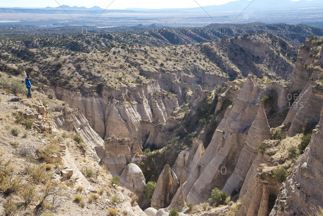Man on cliff overlooking Kasha-Katuwe Tent Rocks National Monument, New Mexico