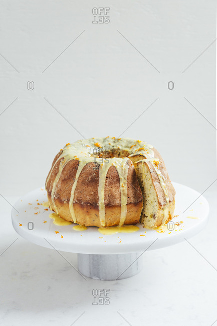 Delicious orange spice cake on marble cake stand