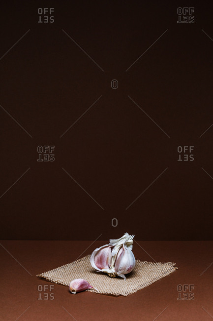 Garlic on brown background