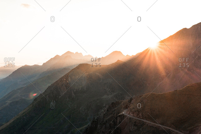Landscape of amazing mountains in sun light and path between in bright day