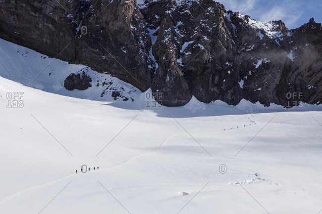 Climbing rope teams ascend the trail above camp muir on mount rainier