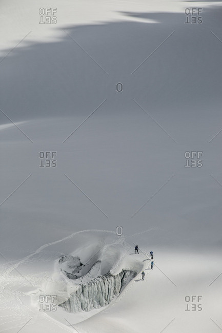 Four alpinists practice safe glacier techniques on le tour glacier