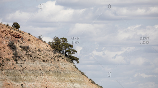 Rock formations stand prominent on the grasslands of north dakota.