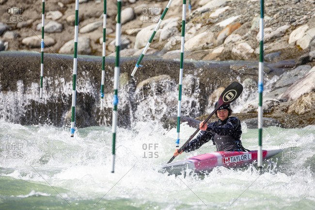 Canada, British Columbia, Pemberton - May 18, 2019: Olympic hopeful kayaker trains at the rutherford whitewater park.