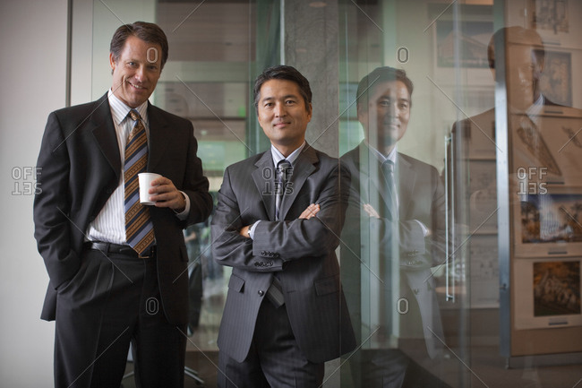 Portrait of two businessmen having a break together in the office.