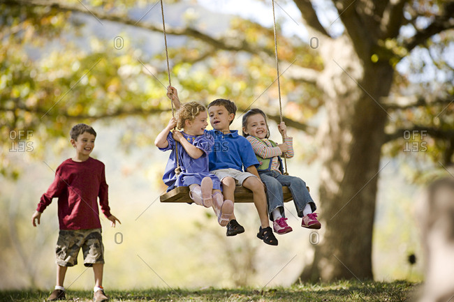 Kids playing on a swing
