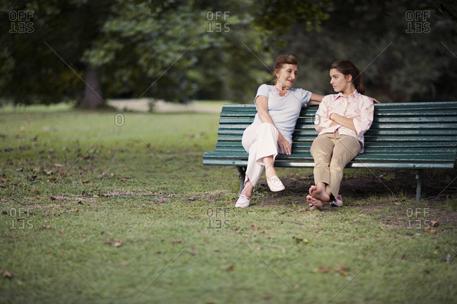 View of a grandmother and a granddaughter conversing.
