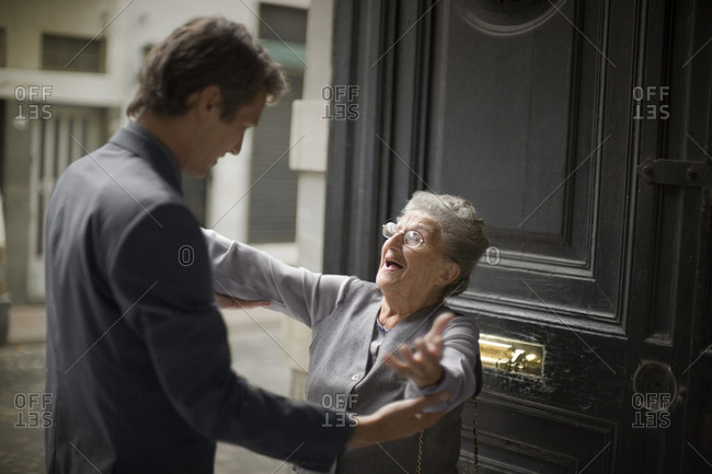 View of an elderly lady embracing her son.