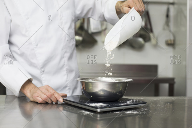 Chef measuring flour on scales