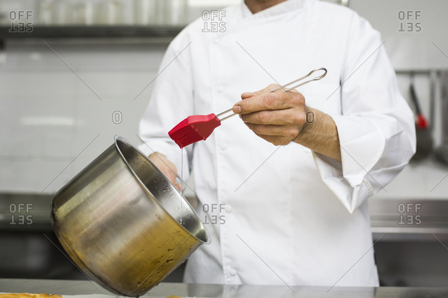 Chef soaking biscuit with syrup