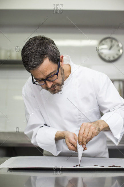 Chef making decorations with pastry bag