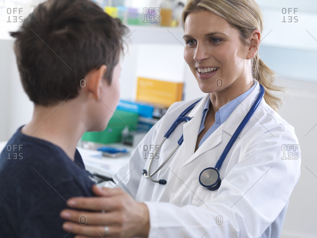 Female doctor giving a boy some guidance during an appointment in the clinic