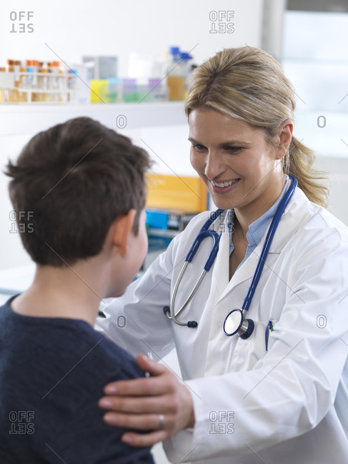 Female doctor giving a boy some guidance during an appointment in the clinic