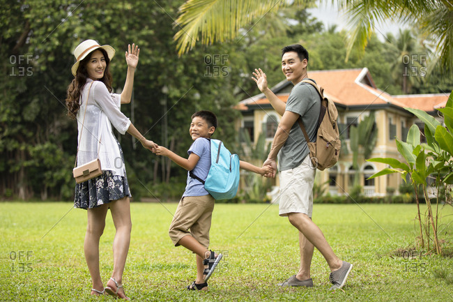 Happy young Chinese family enjoying vacation