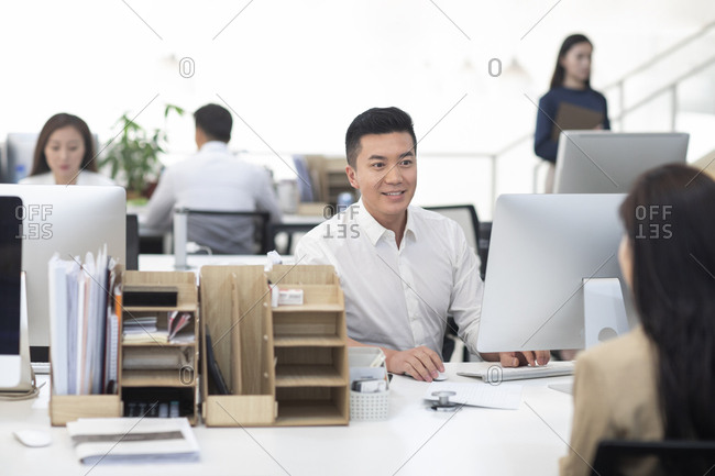 Chinese business people working in office