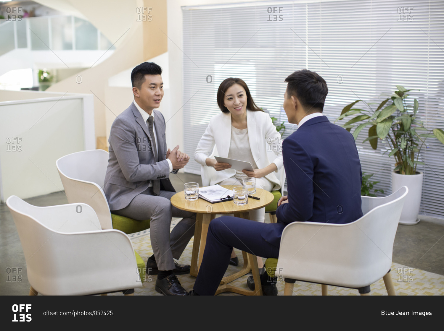 Chinese business people talking in office
