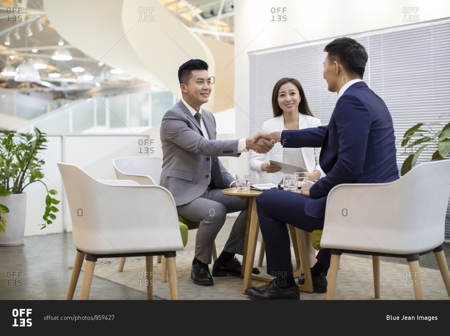Chinese business people talking in office