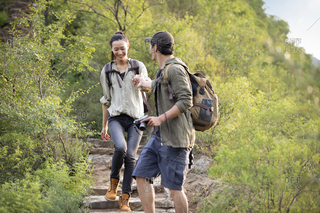 Young couple hiking outdoors