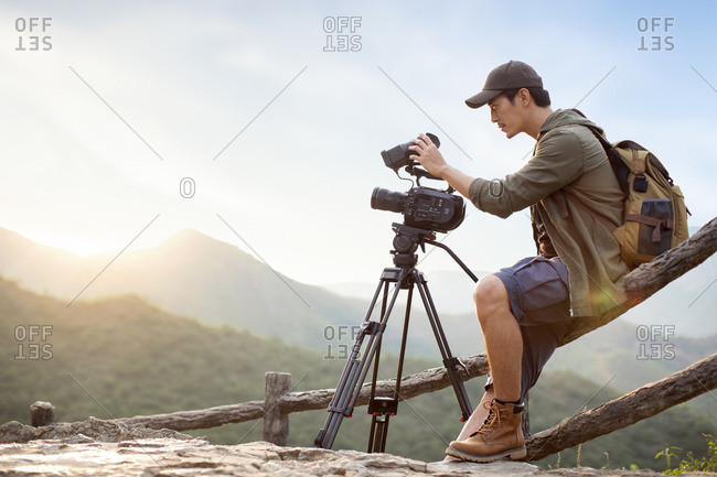Chinese photographer taking photos outdoors