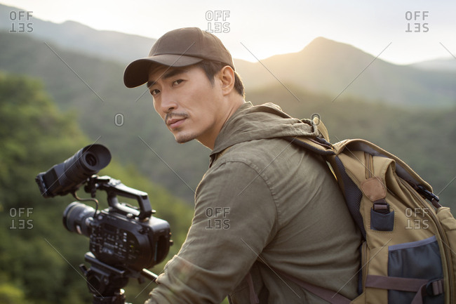 Chinese photographer taking photos outdoors