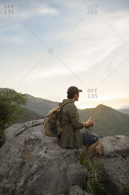 Chinese photographer taking photos outdoors