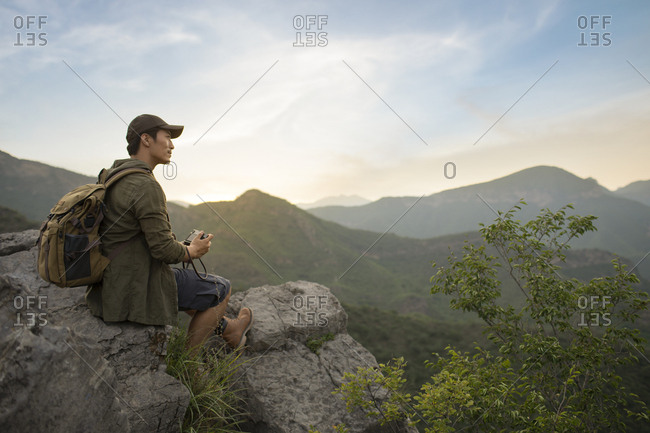 Chinese photographer taking photos outdoors