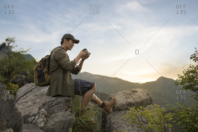 Chinese photographer taking photos outdoors