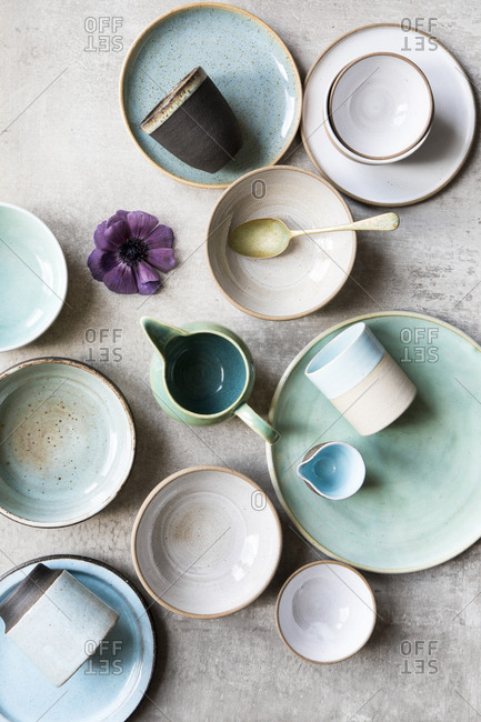 Top view of pastel ceramic plates and cups