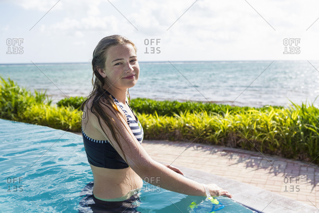 A teenage girl in infinity pool