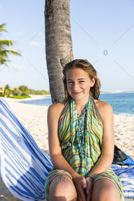 A teenage girl sitting in a beach chair