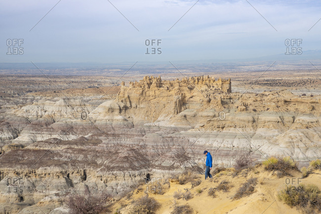Man hiking in the Angel Peak Scenic Area in northwest New Mexico