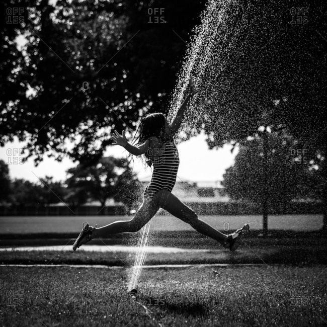 Running Through Sprinkler Stock Photos Offset