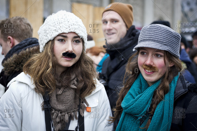 February 23, 2013: Young women with adhesive moustaches at the Hipster Winter Olympiale in Berlin, Germany