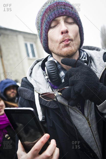 February 23, 2013: A young man taking a selfie at the Hipster Winter Olympiale in Berlin, Germany