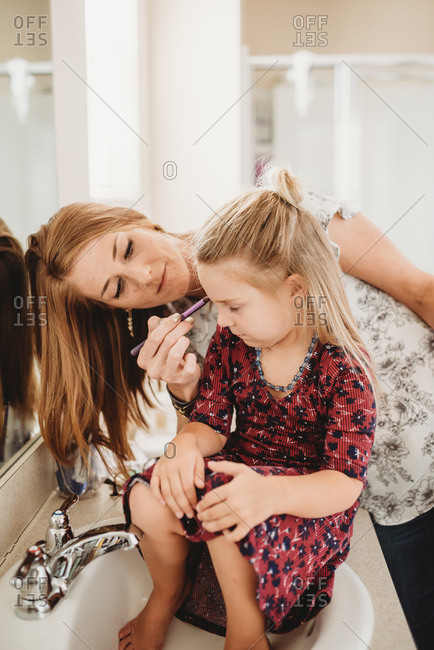Little Girl And Makeup Stock Photos