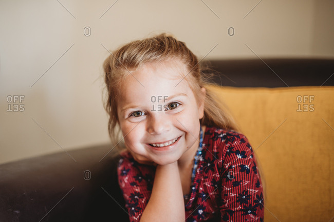 Portrait Of A Sweet Little Girl With Blonde Hair And Brown Eyes